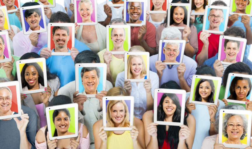 An image illustrating the concept of screener questions, showing a diverse group of people each holding up a tablet computer with their face on the screen