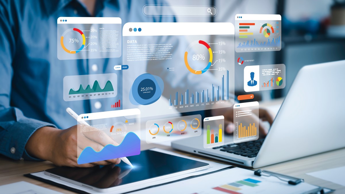 Man analysing lots of charts and graphs to do with his survey data