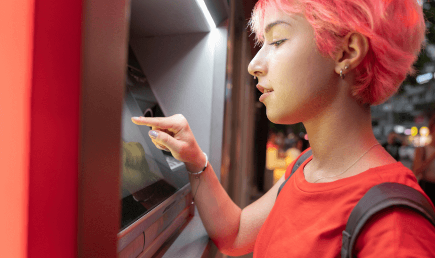 A young female buyer uses a touch screen panel to illustrate the concept of Customer Effort Score