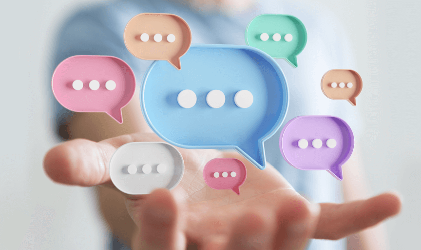 Digitised speech bubbles float over a male users hand, to illustrate the variety of customer feedback tools available