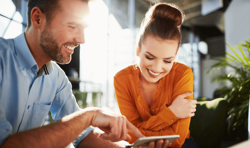 A male survey participant shows his female partner his survey response on his smartphone, to illustrate the concept of response bias in surveys